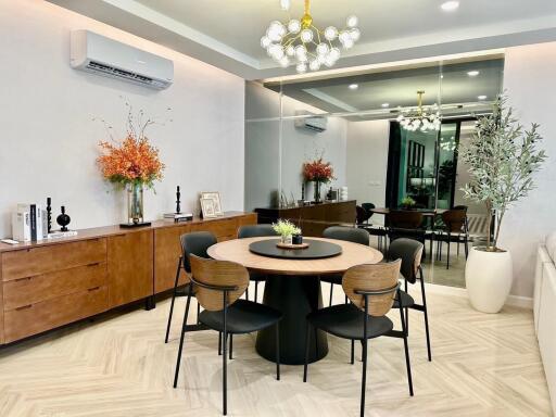 Modern dining room with round table and decorative elements