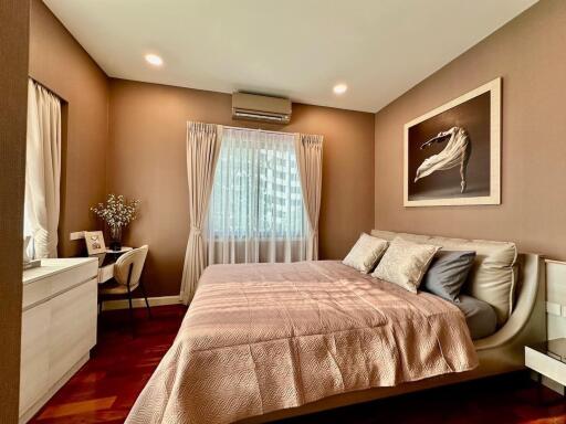 Modern bedroom with double bed and study desk