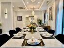 Elegant dining area with a long table set for a meal