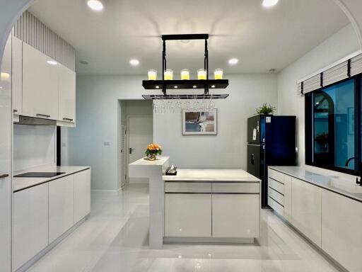 Modern kitchen with white cabinets and island