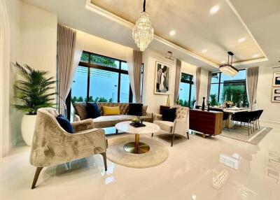 Elegant living and dining area with modern furnishings and decor