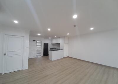 Modern open-plan living room with kitchen