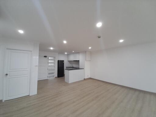 Modern open-plan living room with kitchen