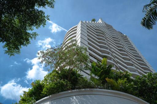 Modern high-rise building with lush greenery