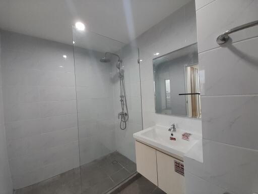 Modern bathroom with walk-in shower and vanity