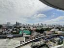 Skyline view of a city with high-rise buildings from a balcony