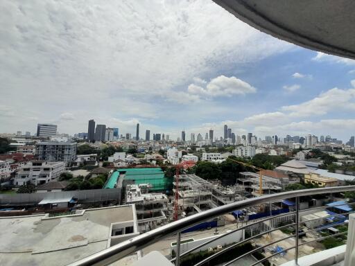 Skyline view of a city with high-rise buildings from a balcony