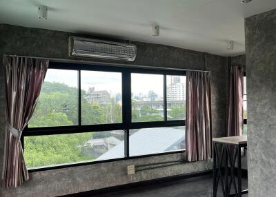 Living room with large windows and curtains