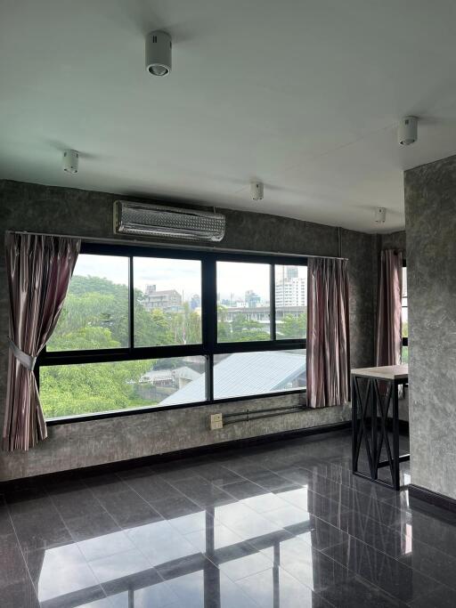 Living room with large windows and curtains