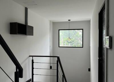 Indoor hallway with a window providing natural light