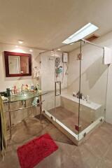 Bathroom with glass shower enclosure and modern fixtures