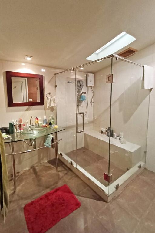 Bathroom with glass shower enclosure and modern fixtures