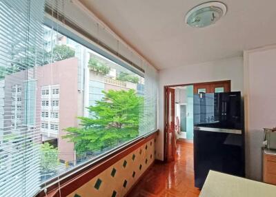 Kitchen with large windows and view of buildings