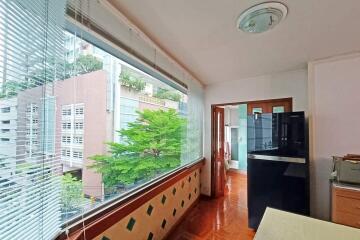 Kitchen with large windows and view of buildings