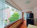 Kitchen with large windows and view of buildings