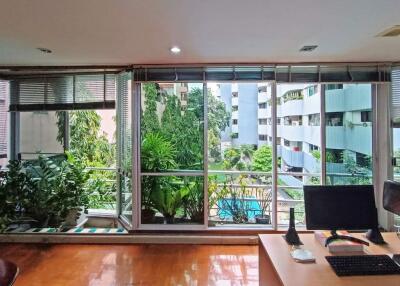 Living room with large windows and view of the outdoors