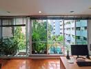 Living room with large windows and view of the outdoors