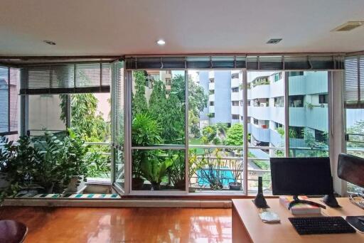 Living room with large windows and view of the outdoors