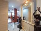 Elegant hallway with art decor leading to a spacious living area