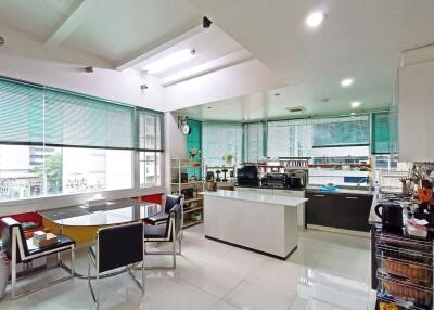 Modern kitchen with dining area and large windows