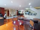 Modern living area with wooden flooring and ample lighting