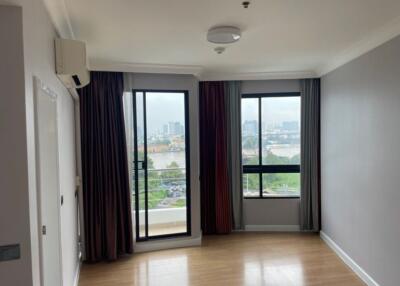 Spacious living room with large windows and a view