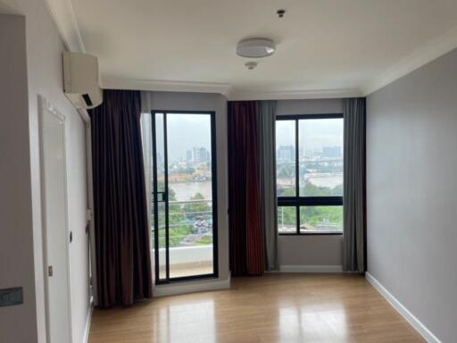 Spacious living room with large windows and a view