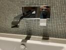 Modern bathroom faucet with tiled backsplash