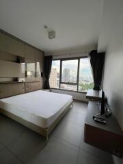 Spacious and modern bedroom with a large window view