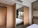 Modern bedroom with mirrored closet and air conditioning