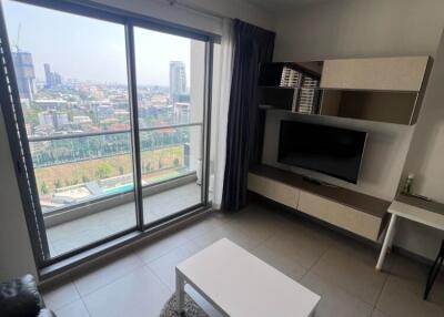 Modern living room with large window and city view