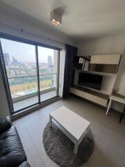 Modern living room with large window and city view