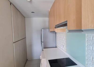 Modern kitchen with light wood cabinetry