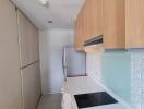 Modern kitchen with light wood cabinetry