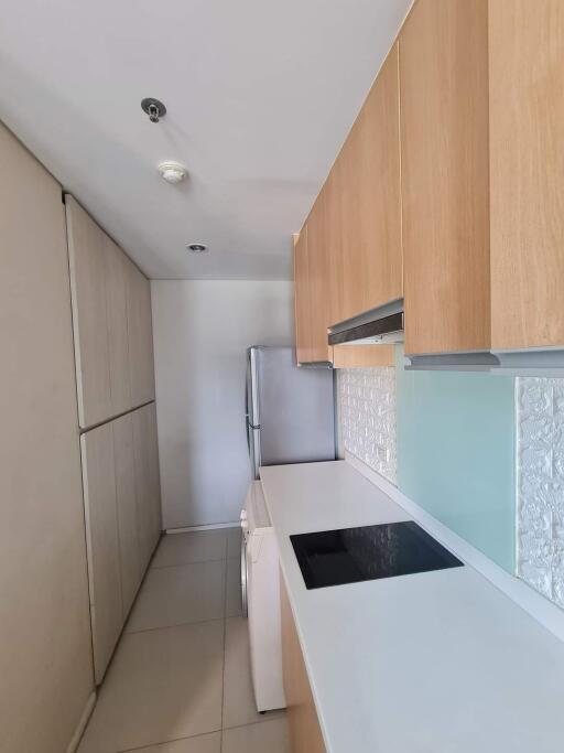 Modern kitchen with light wood cabinetry