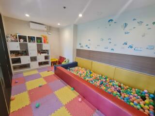 Colorful playroom with ball pit and storage cubes