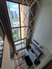 High-angle view of elegant living room with floor-to-ceiling windows