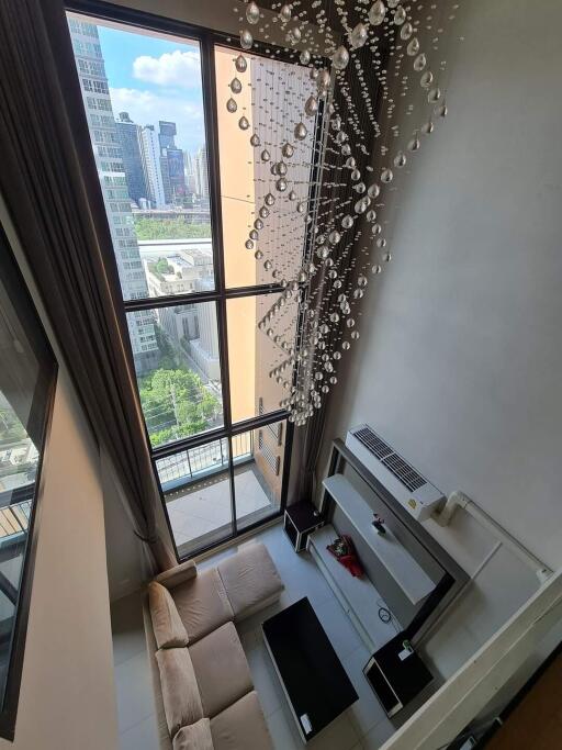 High-angle view of elegant living room with floor-to-ceiling windows