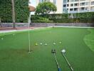 Outdoor putting green with golf clubs