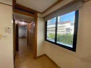 View of hallway with window and wooden elements