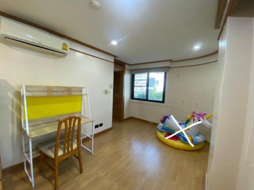 Small bedroom with desk and children