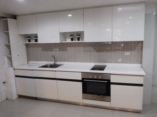 Modern kitchen with white cabinets and appliances