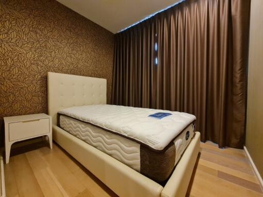 modern bedroom with stylish wallpaper and comfortable bed