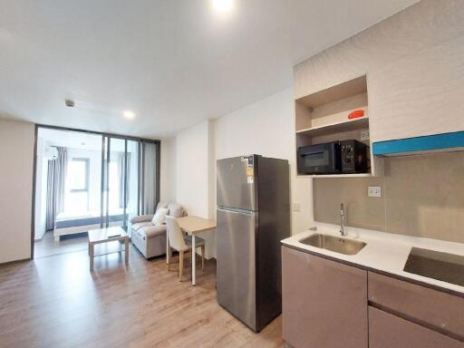 Modern open-plan living room with kitchen and dining area