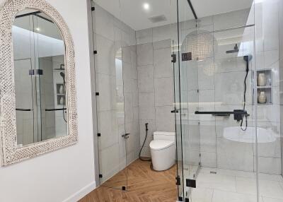 Modern bathroom with glass shower and elegant features