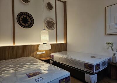 Bedroom with twin beds and decorative wall art