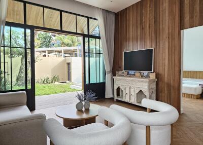 Modern living room with large windows and garden view