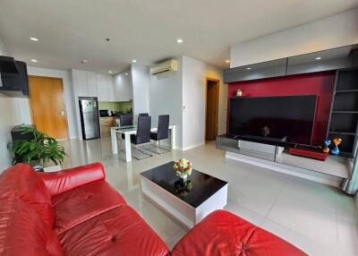 Modern living room with red couch and television