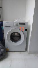 Washing machine in a laundry area