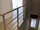 Staircase leading to upstairs living area with bright natural light